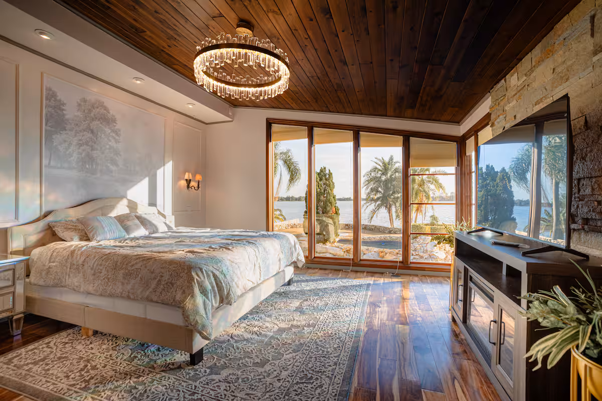 Primary suite with glass doors opening to the deck