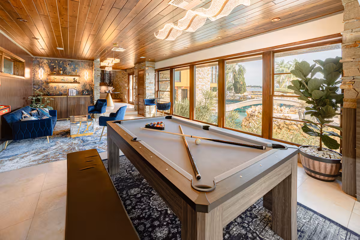 Game lounge with billiards table and arcade cabinet