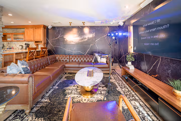 Moody evening lounge with accent lighting and leather seating