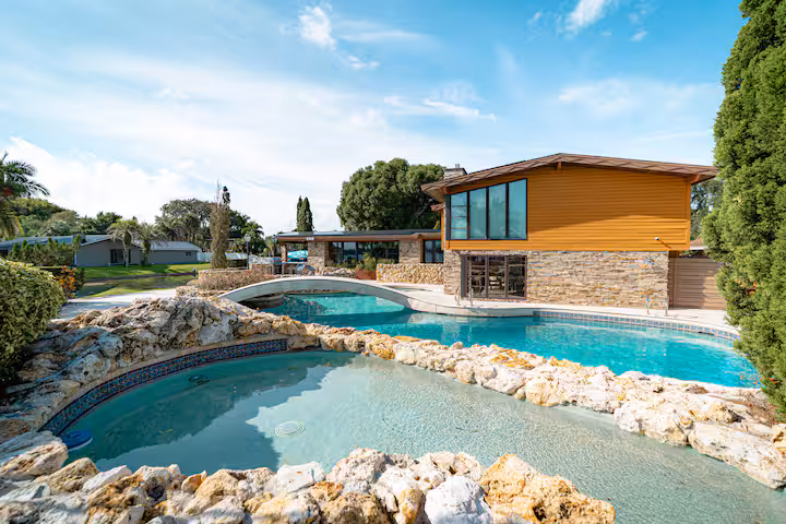 Sheltered lagoon cove pool ringed with boulders