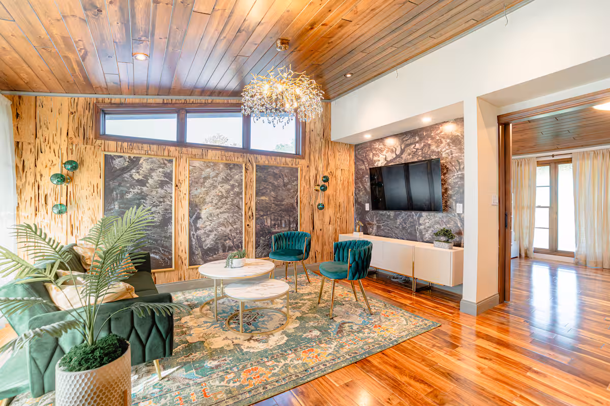 Loft lounge with emerald velvet sofa and gallery lighting